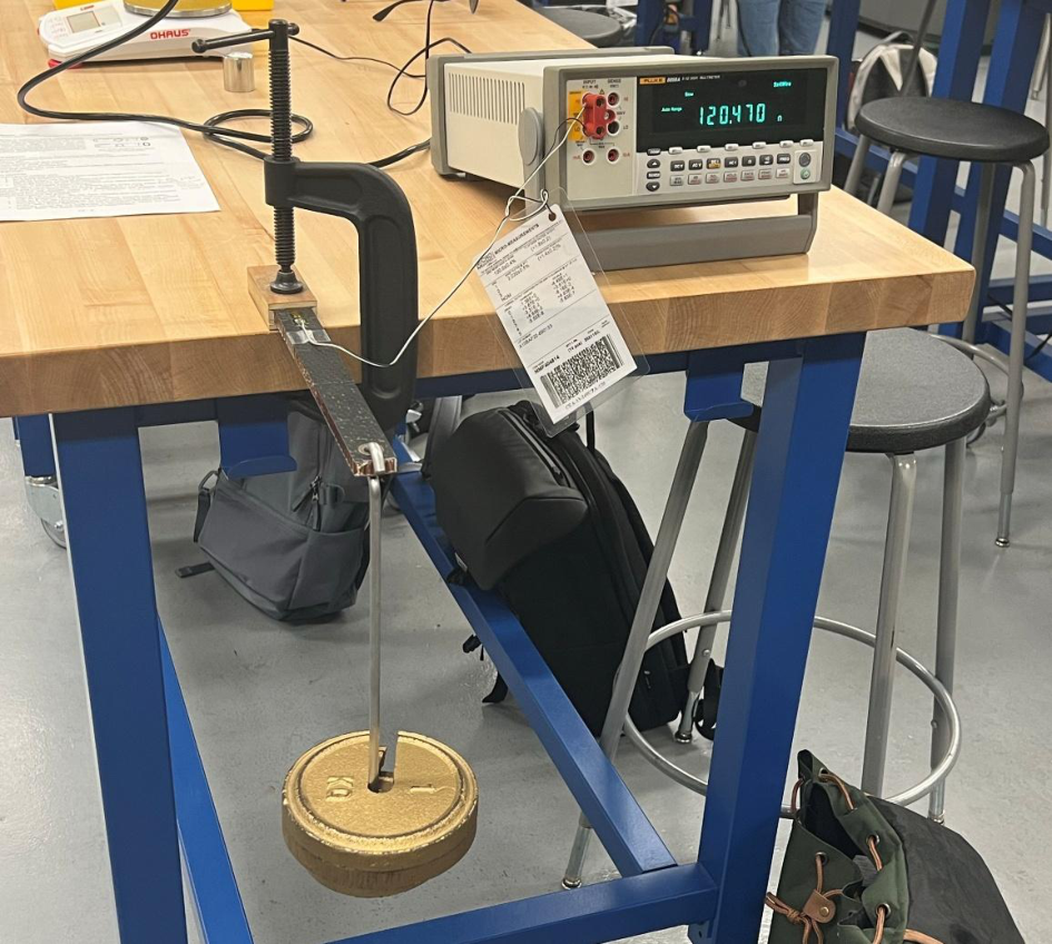 Honeycomb beam with weighted tension