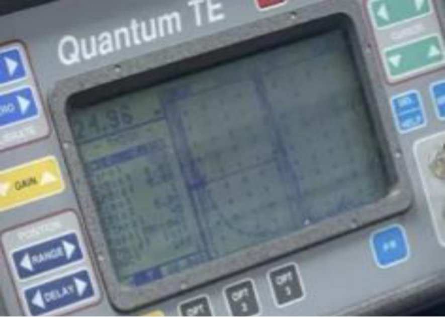 Ultrasonic inspection device screen showing echo pattern for aluminum calibration block
